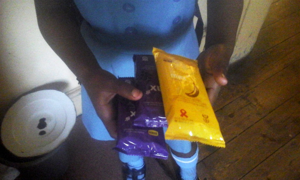 A primary schoolgirl collects condoms allegedly for her gogo.  Photo by Zanda Twala 