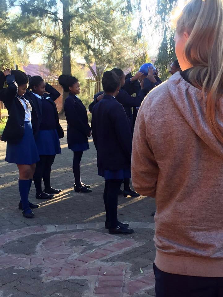Ike Moroe posted the photo on Facebook with this caption: The idiotic treatment our children are subjected to at St. Michael’s in Bloemfontein. They are lined up and a swimming cap is fitted to their heads to check their level of neatness. If the cap does not fit, you are not neat. African hair, African hair. 