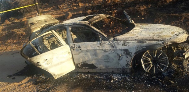 A burnt out car that the robbers used