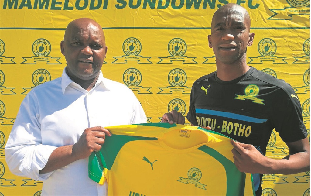 Anele Ngcongca is welcomed to the Mamelodi Sundowns family by coach Pitso Mosimane yesterday.   
