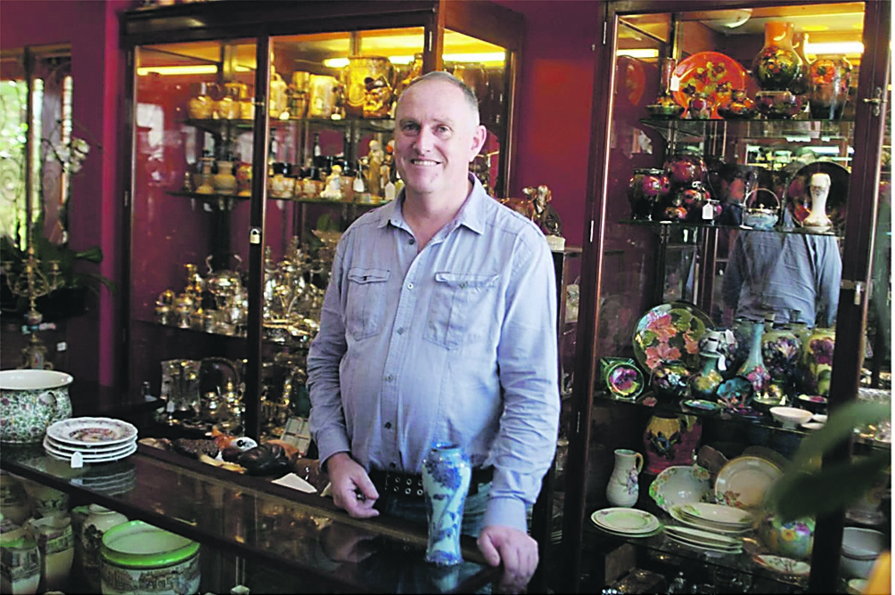 Reputable appraiser Clyde Terry in front of a showcase of antiques. Picture: Eugene Goddard  