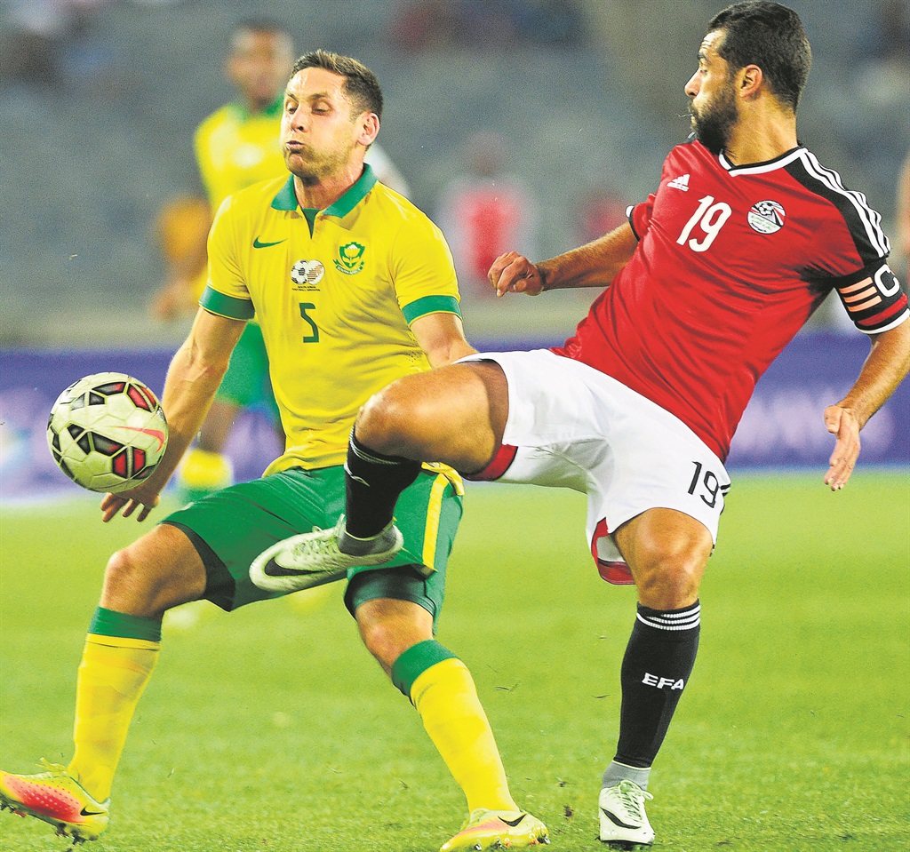 Bafana’s Dean Furman (left) and Abdallah Elsaid of Egypt battle for the ball during their match last night.  Photo by Themba Makofane 