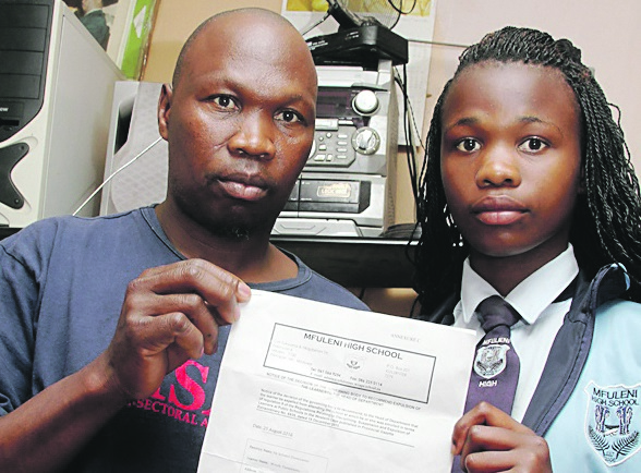 Wendy Dumezweni and her father Solomzi with the unsigned letter of intention to expel her from Mfuleni High School. Photo by Mandla Mnyakama 