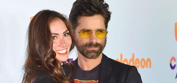 John Stamos and Caitlin McHugh. (Photo: Getty Images)