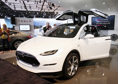 <b>SELF-DRIVING TESLAS?:</b> Tesla CEO Elon Musk says future models will be able to summon their self-parking, self-driving cars using their cellphones in the near future. <i>Image: AFP / Spencer Platt</i>