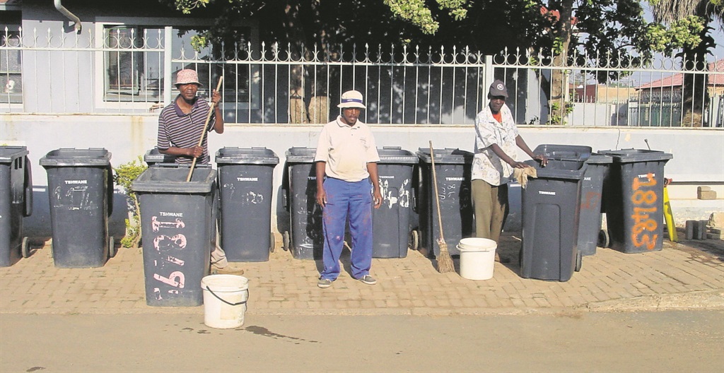 From left: Bin cleaners Magwaza Shibambu, Joe Mahlatji and Richard Maboya.   Photo by Aaron Dube 