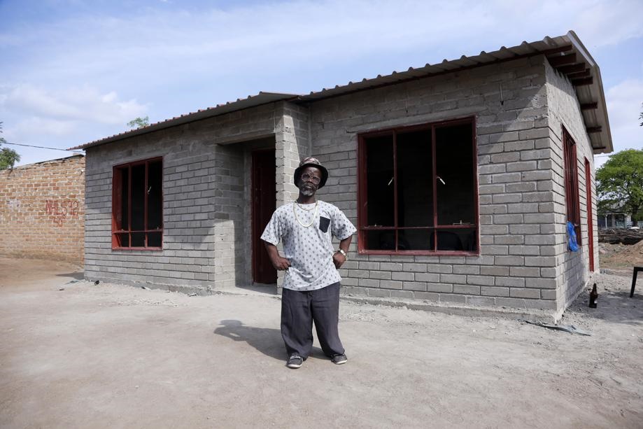 Hlupheka (Boti Majulie) Mabunda showing an RDP house that was recently build after Yena aya kwini phrase trend on Facebook. Photo by Joshua Sebola