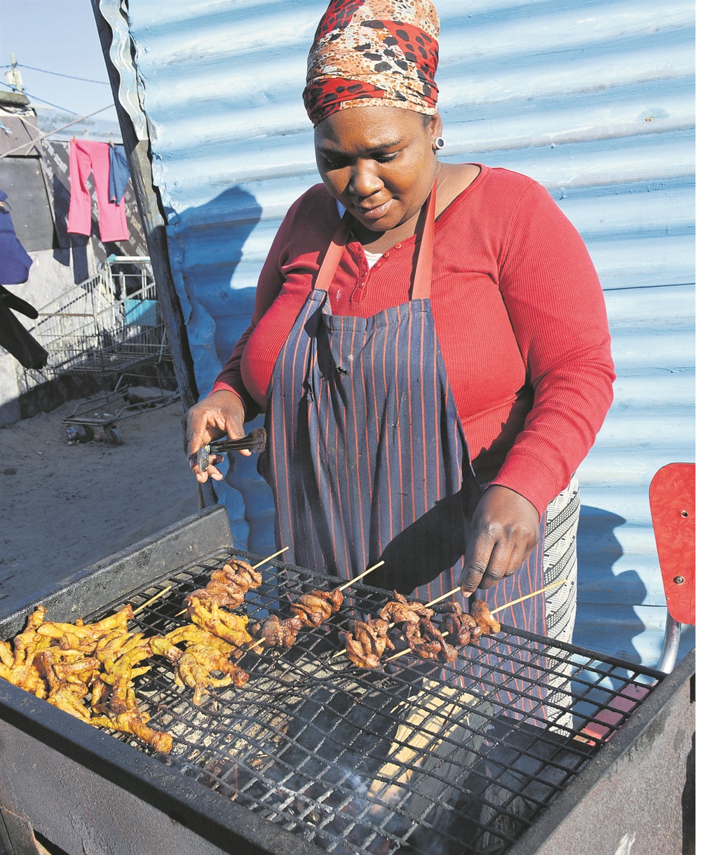 Nolufefe Batallion sells chicken feet and gizzards at her stall in Philippi.         Photo by Lulekwa Mbadamane 