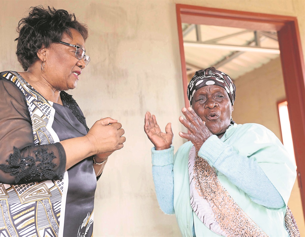 Gogo Ntombi Mabizela (right) couldn’t hide her excitement when she received a new RDP house from KZN social development MEC Weziwe Thusi. The MEC handed over houses to residents whose houses had been destroyed by storms. 