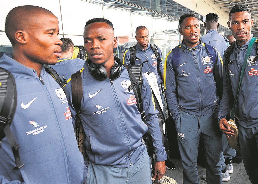 Bafana Bafana leave OR Tambo Airport yesterday en route to Ouagadougou to prepare for their opening 2018 World cup qualifier against Burkina Faso with a warning from Safa CEO Dennis Mumble (inset). Photos by Themba Makofane/ Sifiso Nkosi 