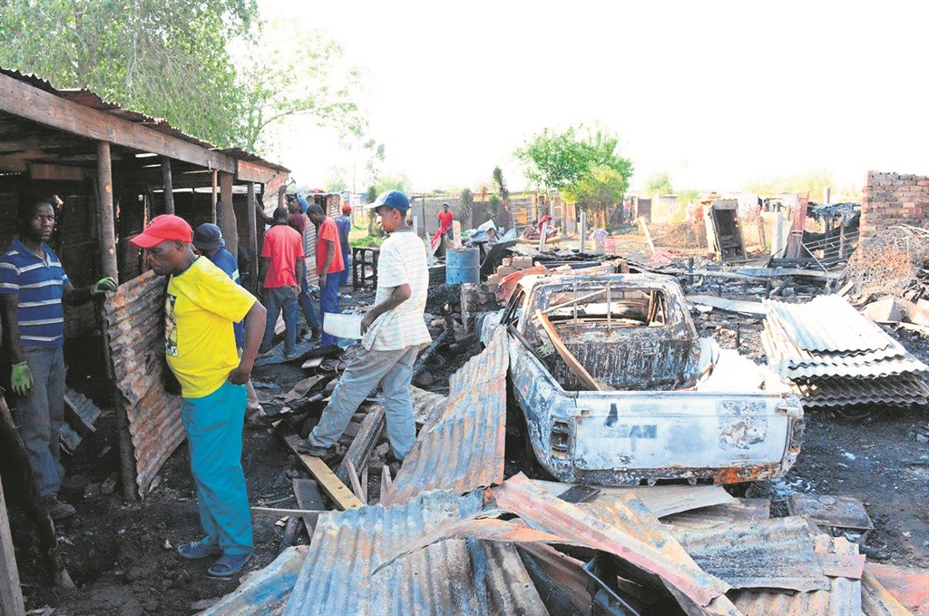 A tuckshop and nine shacks were burnt in a suspected arson attack.      Photo by Nqobile Mashinini   