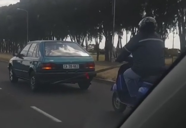 <b> DANGEROUS: </b> A reader in Cape Town spotted a car towing a scooter. <i> Image: Wheels24 </i>