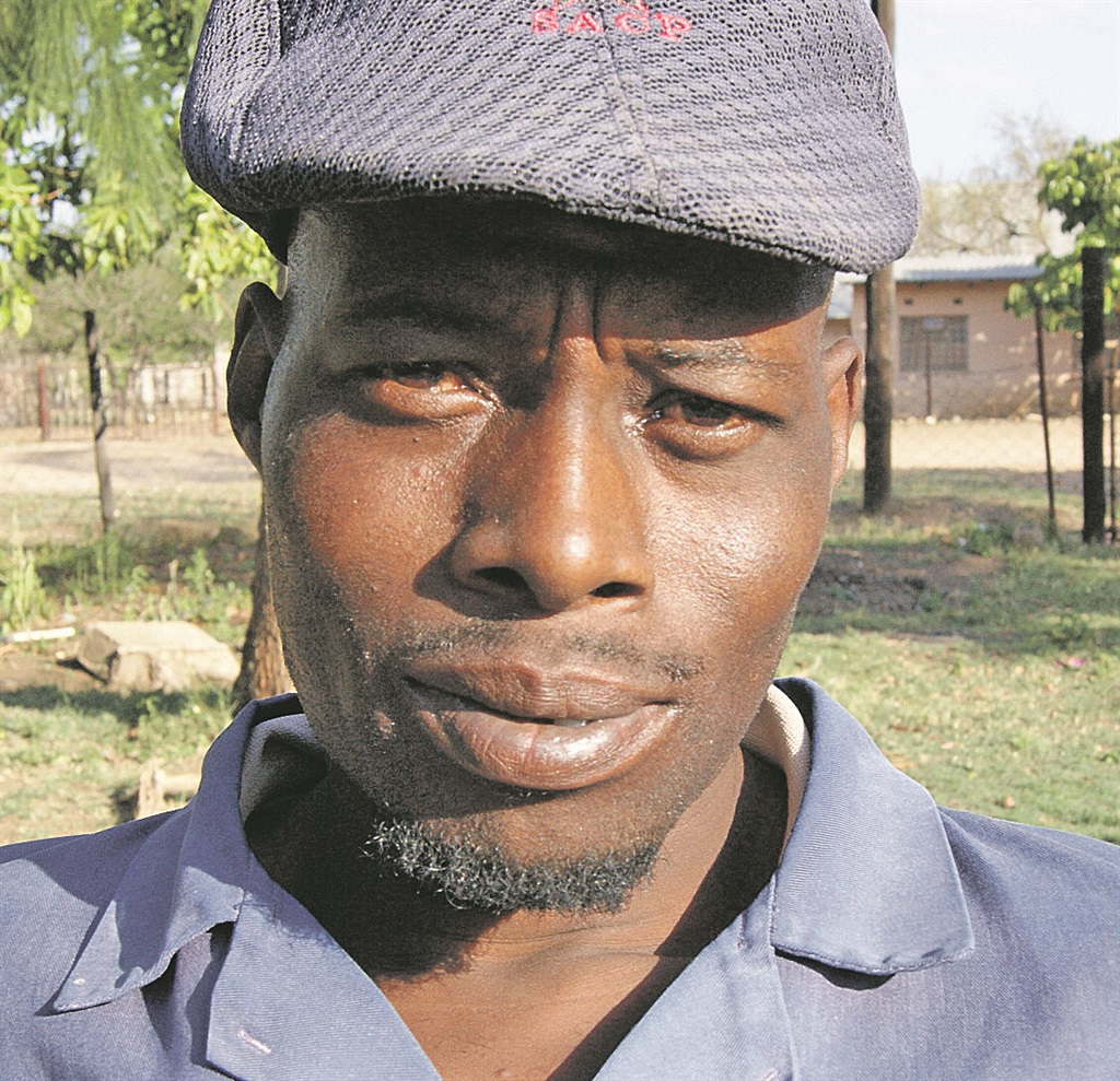 Zacharia Zitha’s wife thought he had spent half his wages on loose women in their village.       Photo by Elizabeth Langa 