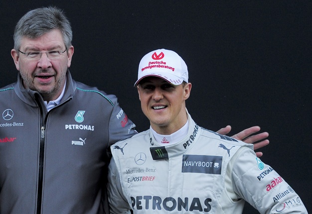 <B> STILL RECOVERING:</B> It's been three years since seven-time Formula 1 champion Michael Schumacher (right) suffered head injuries during a skiing crash in Switzerland. <I>Image: AFP / Josep Lago</I>