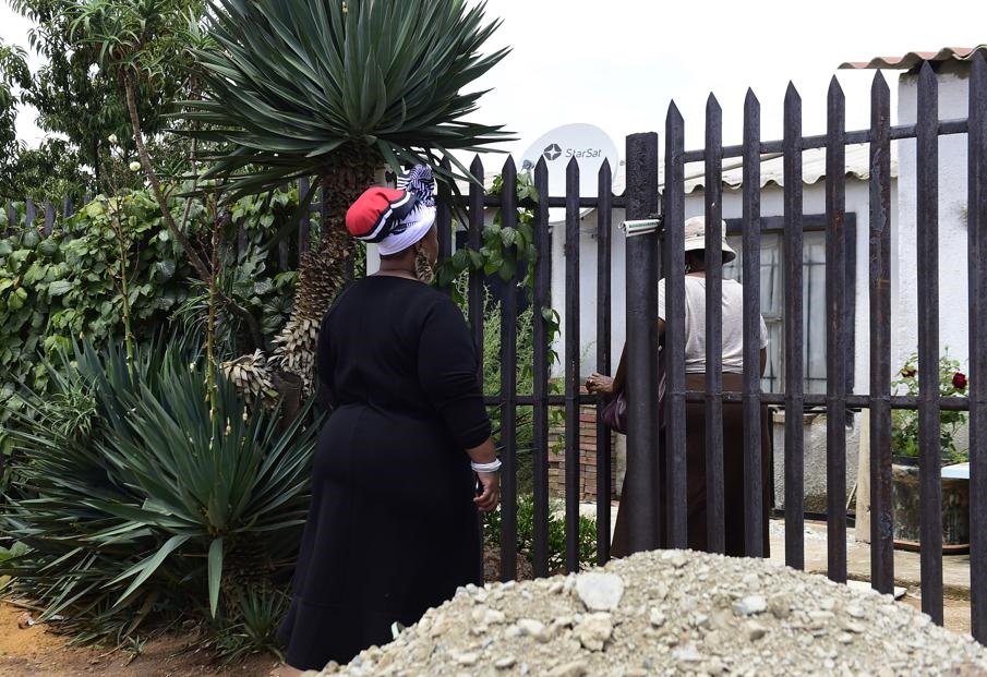 DIGGING FOR TRUTH: Members of the religious commission hesitate before going any further. Photo by Trevor Kunene
