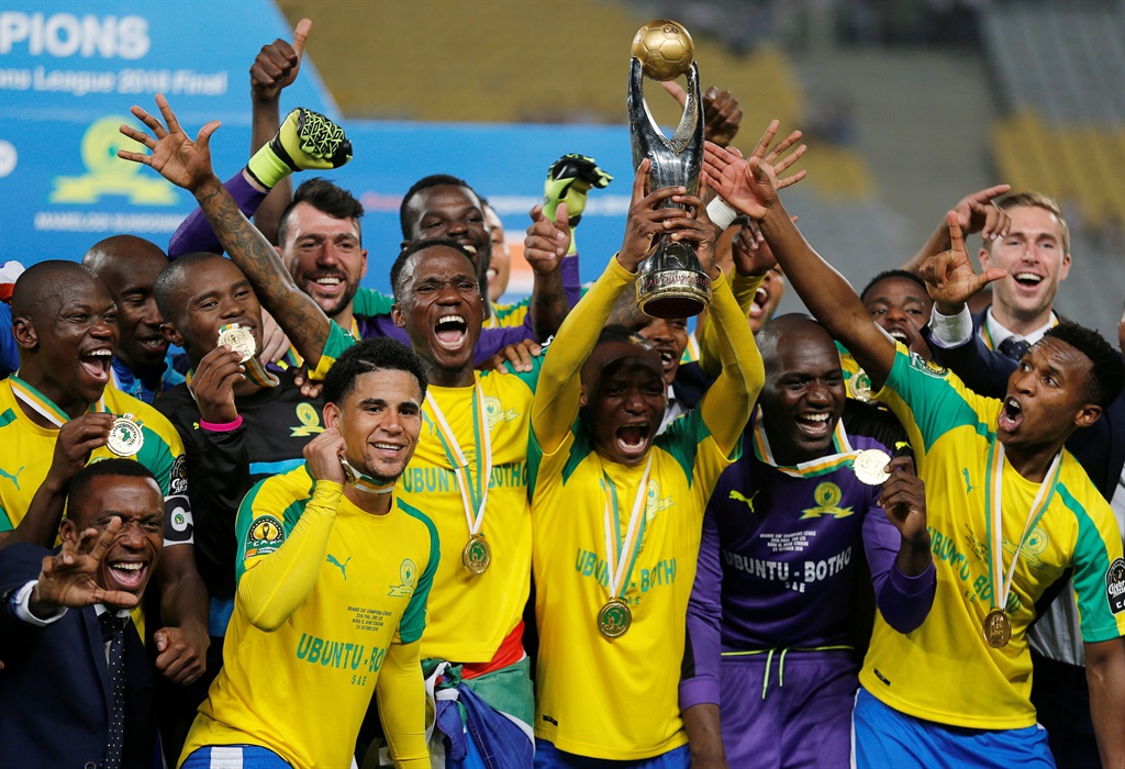 Sundowns players celebrate with the trophy after winning the CAF Champions League. Picture: Amr Abdallah Dalsh/Reuters 
