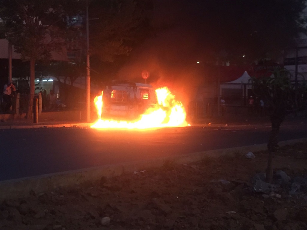 The police van that was set alight by student protesters. Picture: Shandukani Mulaudzi/City Press 