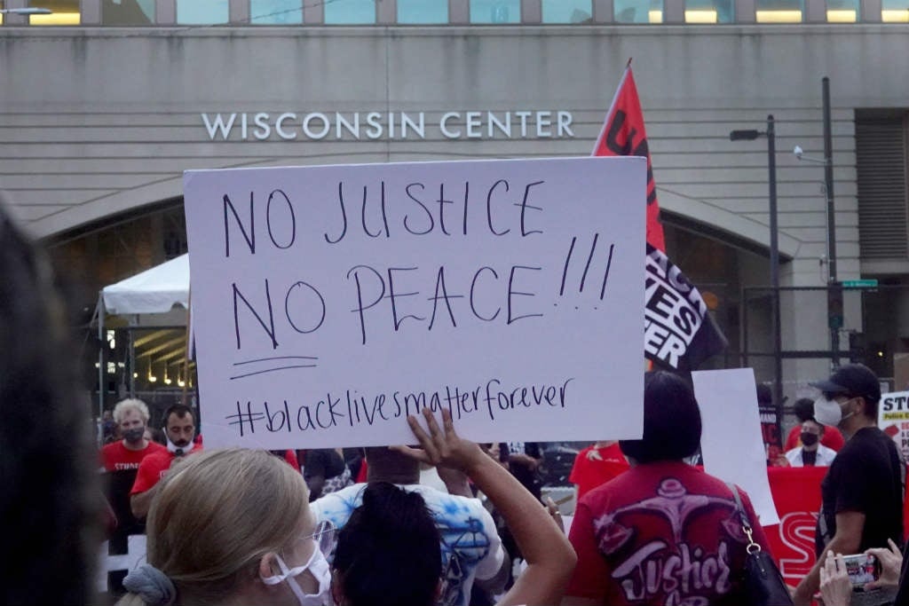 Protests erupt after reportedly unarmed black man shot by police in