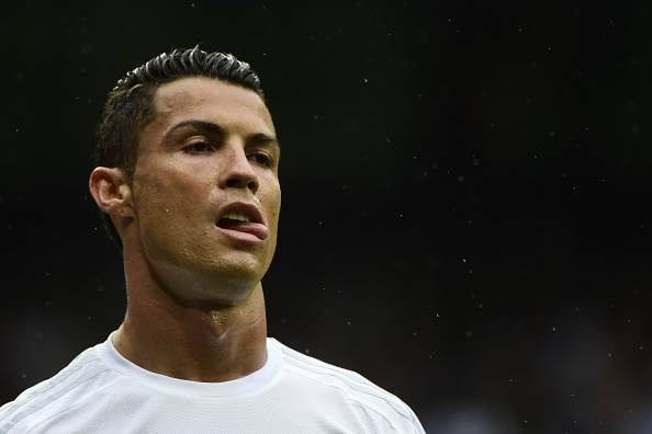 Cristiano Ronaldo sticking his tongue at the line up on Make a GIF