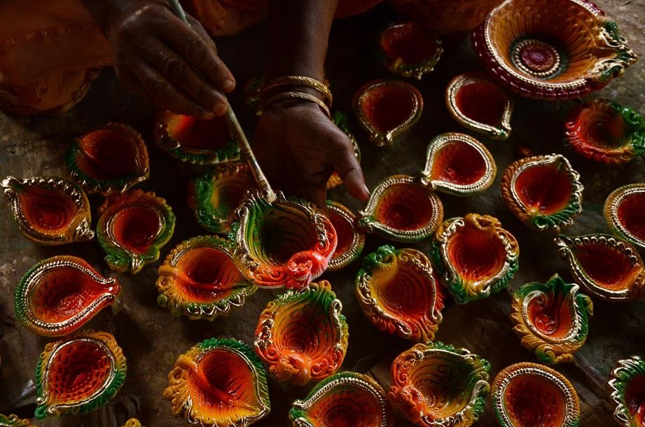 An artisan paints a diya for the Diwali festival in the rural area of west Bengal, India. Picture: Sonali Pal Chaudhury/NurPhoto via Getty Images