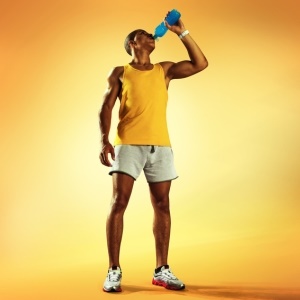 Athlete enjoying an energy drink – iStock