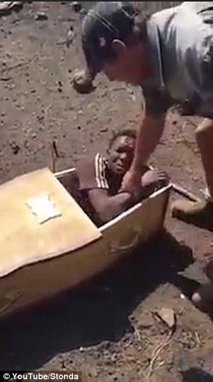 Screenshots of a video showing a black man being forced into a coffin by a suspected white farmer sparked a debate on social media yesterday.