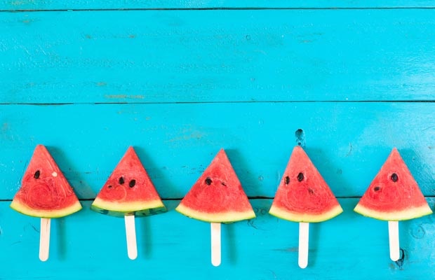 wedges of watermelon on blue background