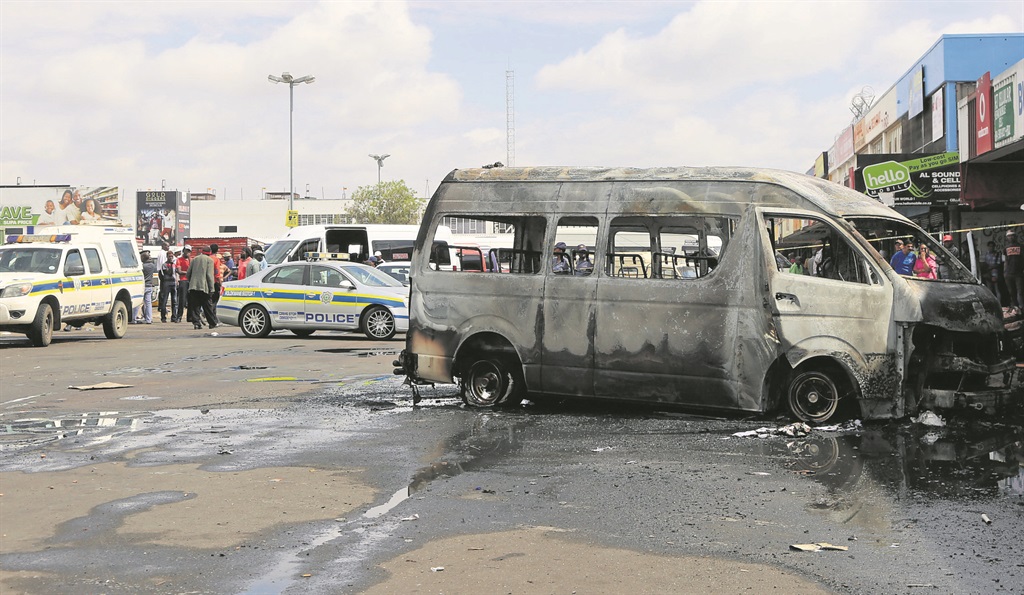 This taxi, belonging to the Polokwane Sibasa Taxi Association, was burned after taxi violence broke out in the city.                Photo by Joshua Sebola  
