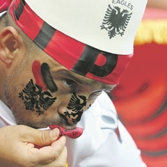 An Albanian fan kisses his shirt before the Euro 2016 match against Romania. (Catherine Ivill, Getty Images)