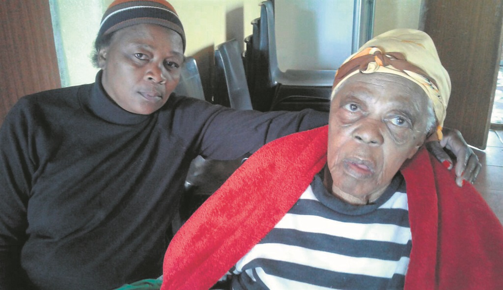 Sivuyile Coto’s aunt Moli Majola and his gogo, Neli Toba, mourn for the young man who was the breadwinner in their family.                    Photo by Thamsanqa Mbovane 
