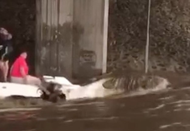 <b> BAD DREAM: </b> A Toyota Supra owner watches his car engulfed by a flash flood in Johannesburg. <i> Image: Instagram </i>