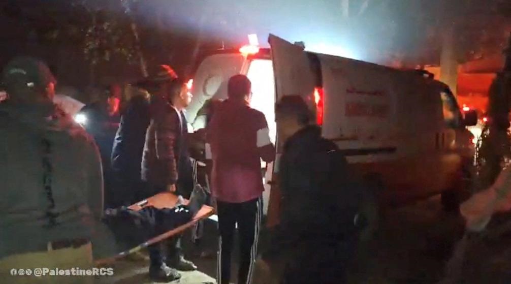 Medical workers transfer a person they say was injured in shelling to an ambulance, in a location given as Deir Al-Balah, Gaza, in this screen grab taken from a social media video released on February 6, 2024. Palestine Red Crescent Society/via REUTERS 