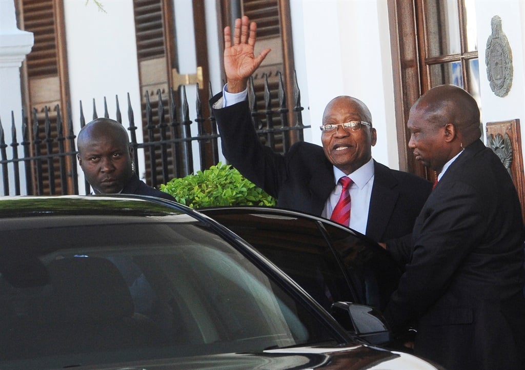 President Jacob Zuma waves as he leaves Parliament. Picture: AP