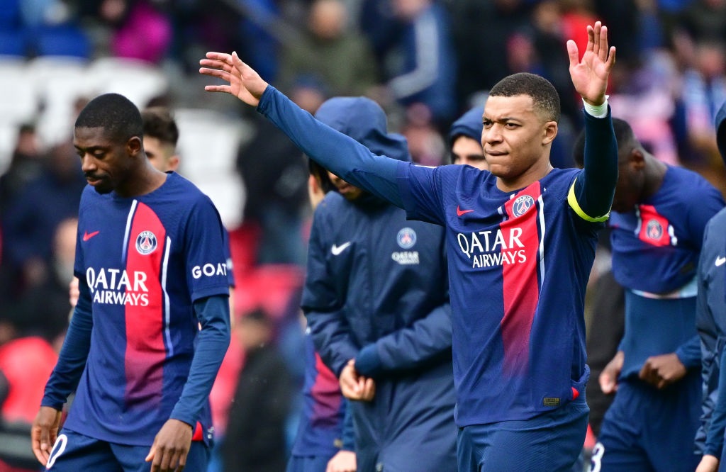 PARIS, FRANCE - MARCH 10:  Kylian MbappÃ© of PSG celebrates with teammates after winning the Ligue 1 Uber Eats match between Paris Saint-Germain and Stade de Reims at Parc des Princes on March 10, 2024 in Paris, France. (Photo by Christian Liewig - Corbis/Getty Images)