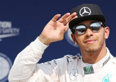 <b>39TH CAREER WIN LOOMS:</b> Mercedes' Lewis Hamilton waves to crowds at the Hungaroring. He could clinch his 39th career win at the 2015 Hungarian GP. <i>Image: AP / Ronald Zak</i>