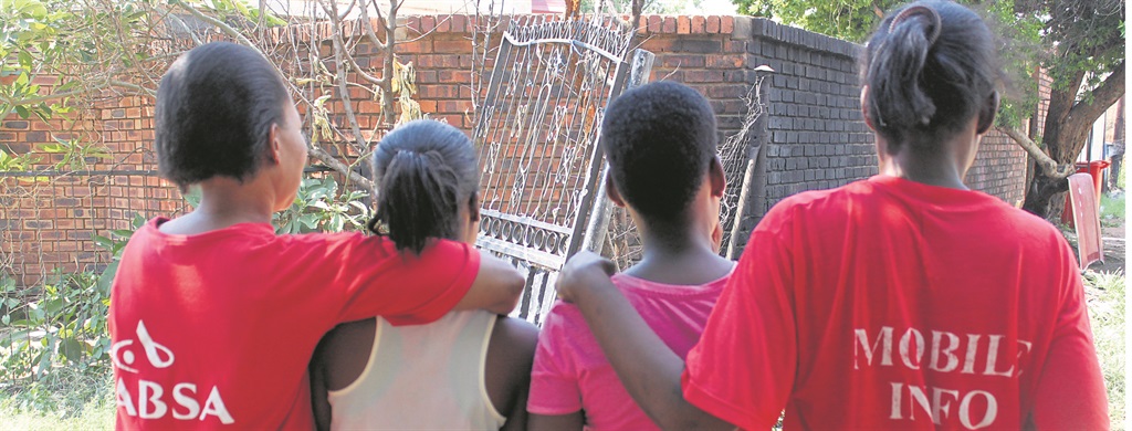 Two mums with their kids who claim dikhorane robbed them of their cellphones.          Photo by Andrew Mkhondo 