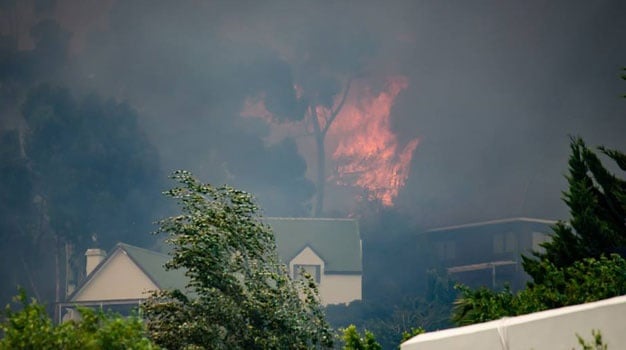 Firefighters are battling the blaze which has destroyed property in Somerset West. (Ian Kitney, Kingdom Photography)