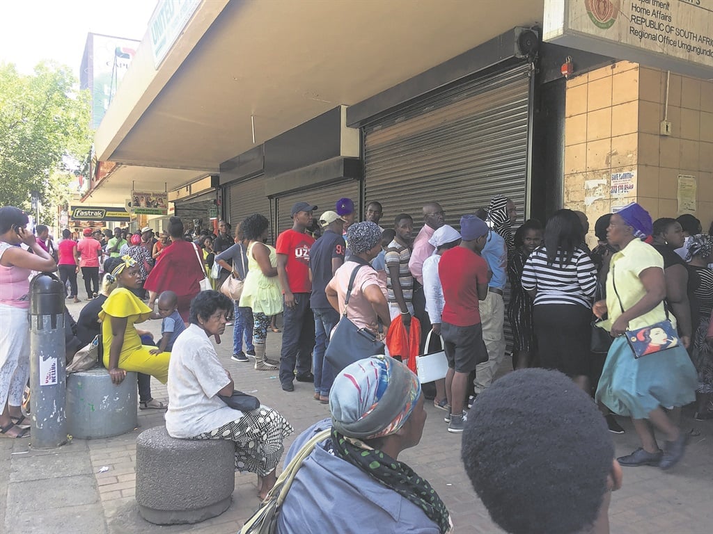 People queue outside the Home Affairs building on Church Street. Photo: Nokuthula Khanyile