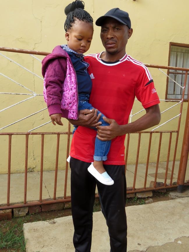 Lawrence Gulele and her daughter Sbahle who was grabbed by the pitbull. Photo by Ntebatse Masipa