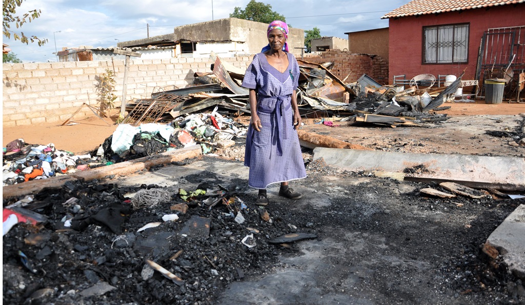 Gogo Constance Thobela was asleep in her RDP house when a shack in the yard burnt down.           Photo by Samson Ratswana 