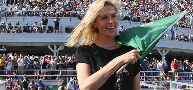 Charlize Theron waves the green flag to start the Monster Energy NASCAR Cup Series 60th Annual Daytona 500. (Photo: Getty Images)
