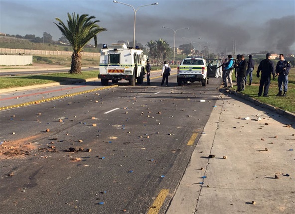 <p>Eastern Cape police on Monday denied earlier using live
ammunition to quell protests in Port Elizabeth’s Northern Areas.

&nbsp;
</p><p>“Public Order Police, Tactical Response Teams and local
police members have been deployed to bring the situation under control and
subsequently used a water cannon, fired stun grenades and rubber bullets to
disperse the protestors.&nbsp; It must be made very clear that under no
circumstances was any live ammunition used by the SAPS,” said spokesperson
Captain Sandra Janse van Rensburg in a statement.

&nbsp;

</p><p>Police warned community members that, although they have
the democratic right to protest, they must do so within the boundaries of the
law and respect the rights of non-participating public members. 

&nbsp;
</p><p>“Disregard for the law will not be allowed and those who
fail to adhere to this will be arrested, charged and brought before a court,” Janse
van Rensburg said.

&nbsp;
</p><p>This comes after members of the community started
blocking and barricading roads with various items including burning tyres,
mattresses and rubbish. The protestors also started throwing stones which
damaged police and other vehicles.

&nbsp;&nbsp;
</p><p>The public is advised to avoid Stanford Road, Gail Road
and 3rd Avenue and also roads between Hartebees Street and Pienaar Street, due
to complaints of stone throwing reported there. &nbsp;

&nbsp;

</p><p>The situation is under control and the SAPS will continue
to monitor and maintain high visibility in the area including air support to
all the affected areas.&nbsp; No arrests have been made as yet. 

</p>