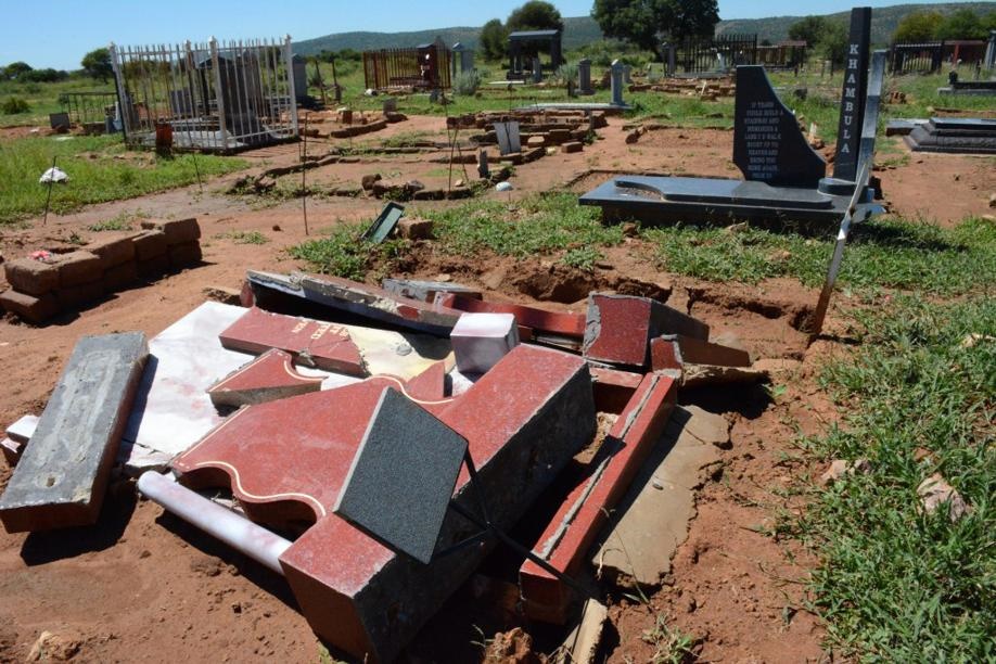 Some of the graves at Vaalbank Cemetery that were damaged by last week's heavy rain. Photo by Bongani Mthimunye.