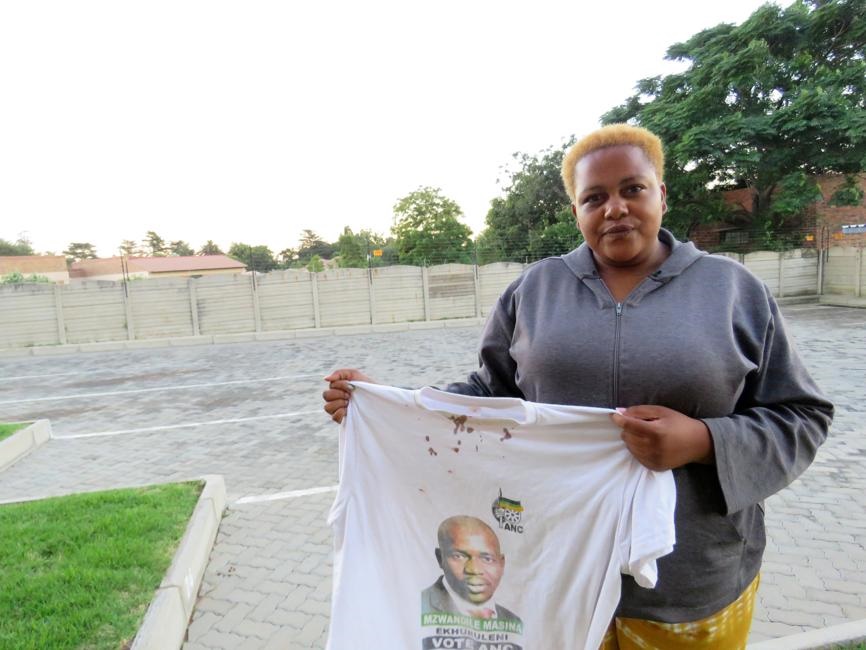 Rose Kgabane shows blood on the T-shirt she was wearing on the day she was assaulted. Photo Ntebatse Masipa

