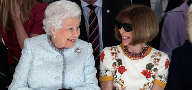 Queen Elizabeth and Anna Wintour sit front row at London Fashion Week. (Photo: Getty Images)
