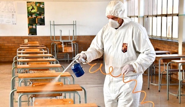 A worker sanitises a classroom at a Johannesburg school.