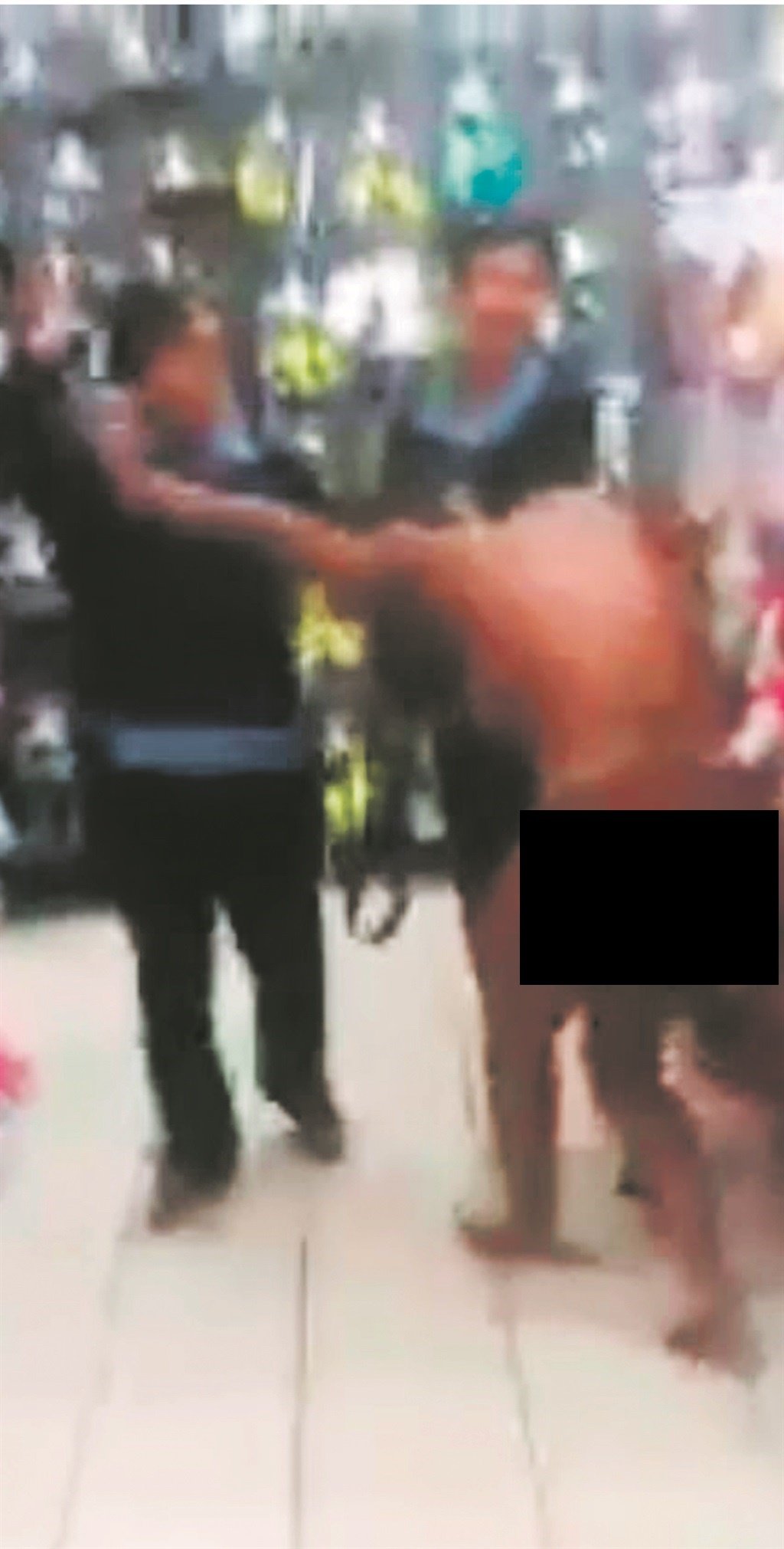 Screen grabs from the video show the alleged shoplifter being whipped.