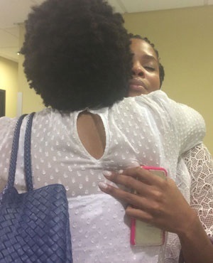  Sihle Bolani is comforted by her mother Phumla following the day’s court proceedings.  Picture: Tshidi Madia, News24 