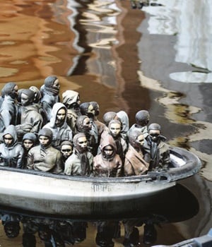 A remote-controlled boat by Banksy depicts desperate migrants at the white cliffs of Dover. PHOTO: Getty Images
