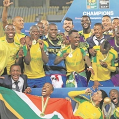 Sundowns players celebrate the 2016 CAF Champions League championship. (Gavin Barker, BackpagePix)
